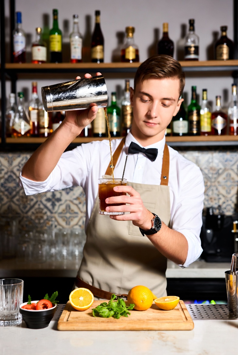 Bartenders in Toronto mixing custom cocktails for Culinary Search Group luxury events